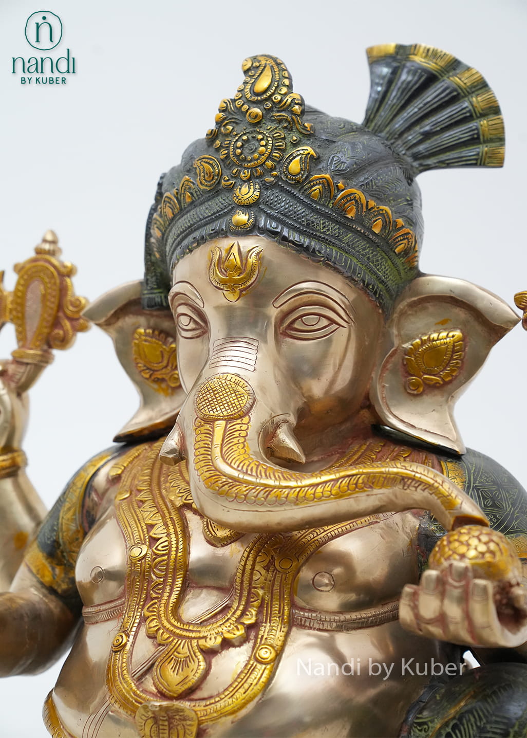 Decorative brass Lord Ganesha statue with a royal pagdi design, intricate detailing, and an elegant antique finish symbolizing wisdom, prosperity, and good fortune.