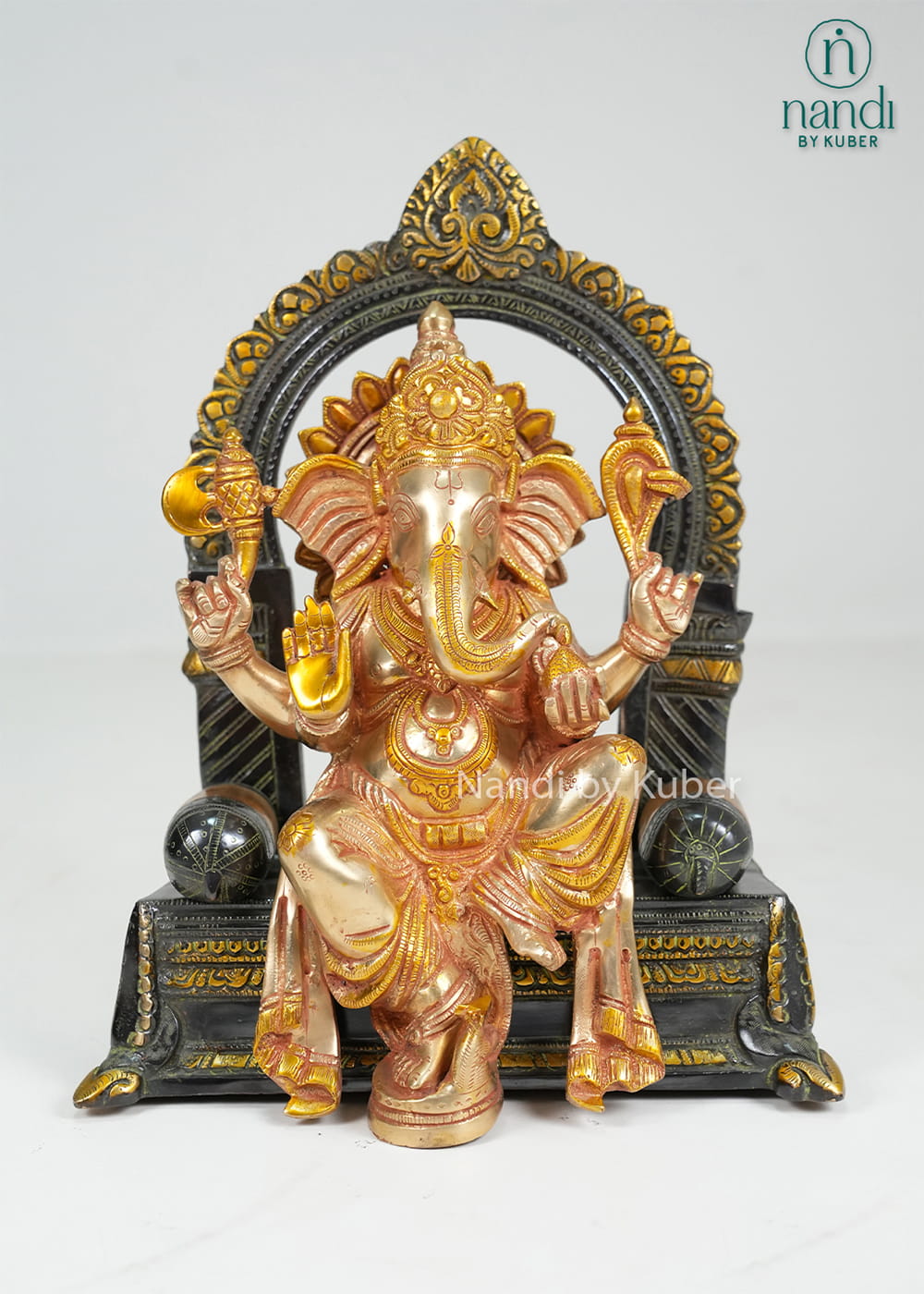 Brass Ganesha on sinhasan arch