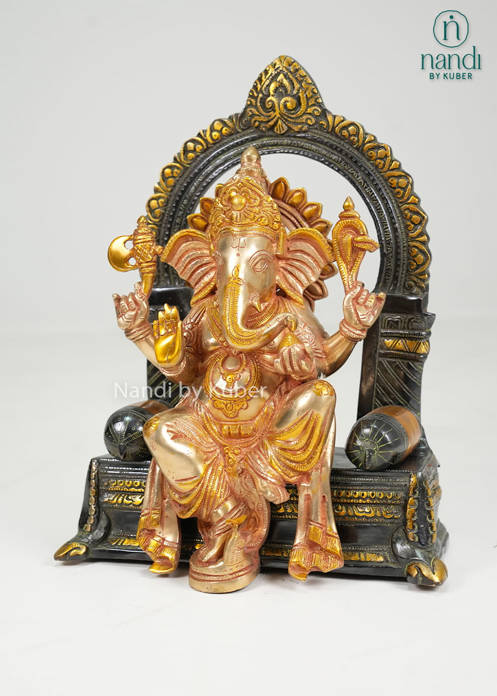 Brass Ganesha on sinhasan arch
