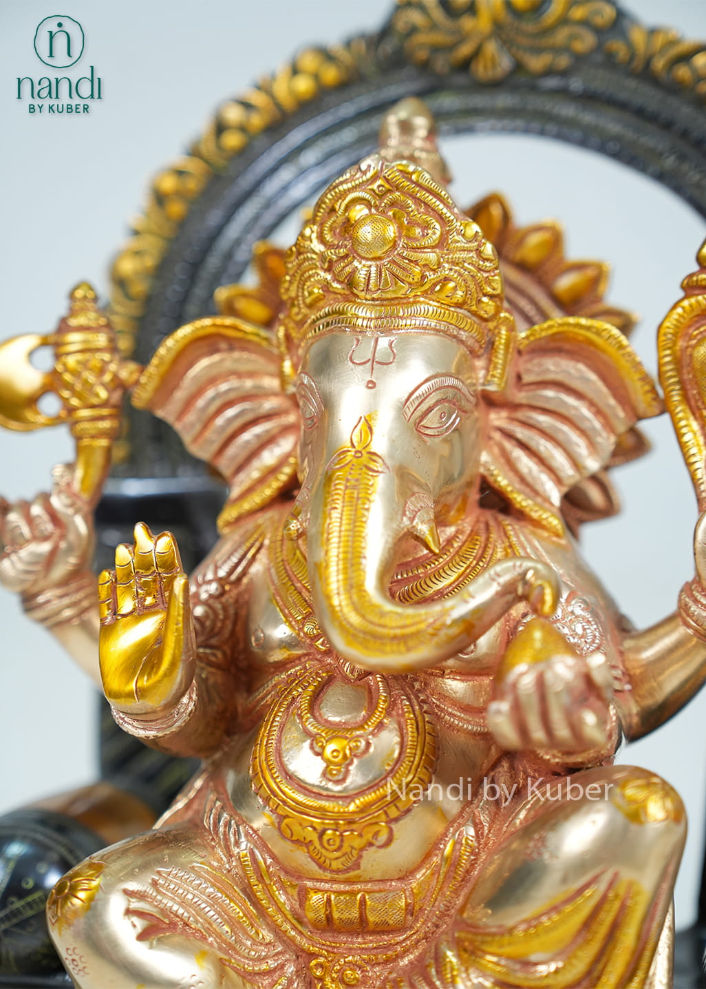 Brass Ganesha on sinhasan arch