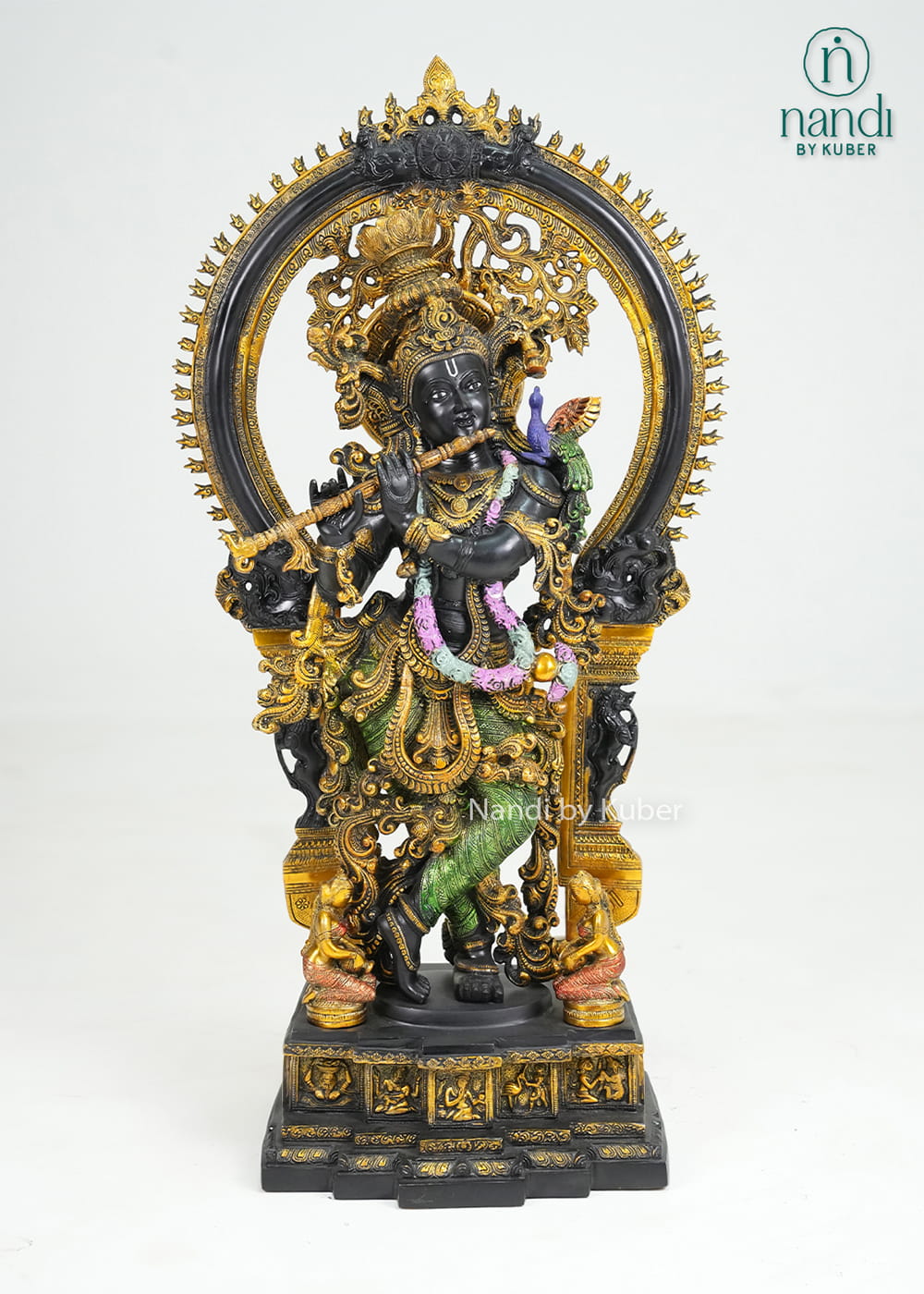 Decorative brass Krishna statue with ornate arch, flute, and multicolor detailing