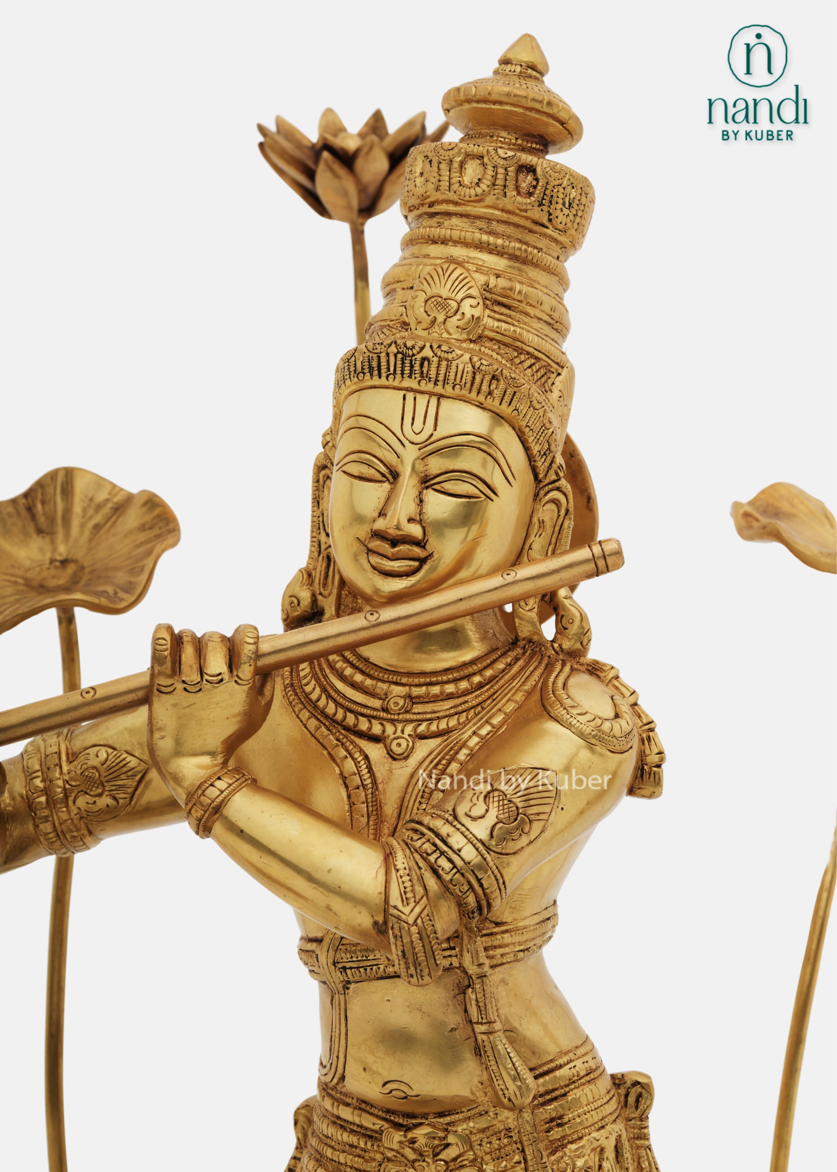 Brass Krishna flute idol with lotus decor