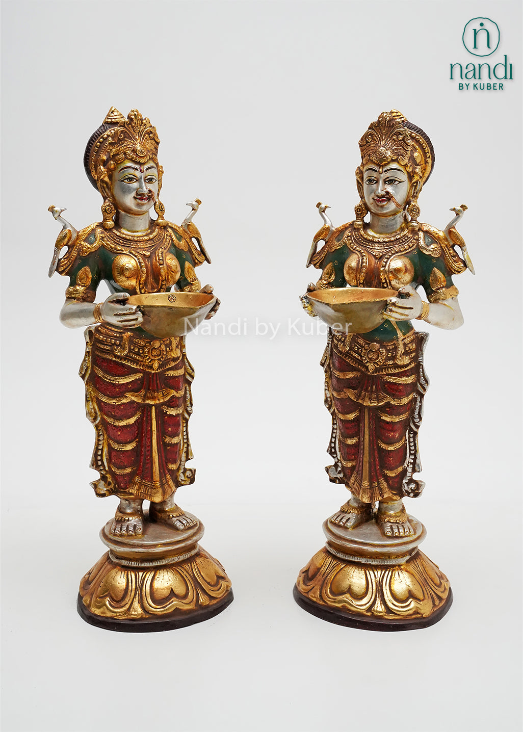 Handcrafted pair of Goddess Lakshmi idol statues with lotus bases, decorative offering bowls, and rich gold-tone detailing, ideal for Diwali décor, pooja rooms, temples, and spiritual home interiors.