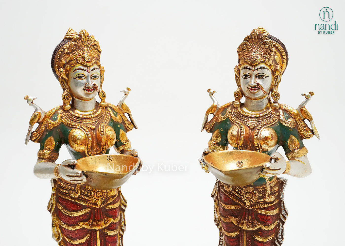 Handcrafted pair of Goddess Lakshmi idol statues with lotus bases, decorative offering bowls, and rich gold-tone detailing, ideal for Diwali décor, pooja rooms, temples, and spiritual home interiors.