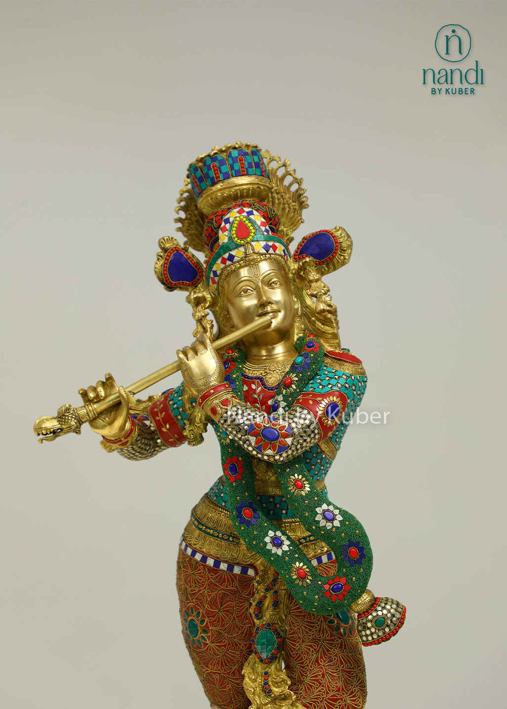 Intricately handcrafted brass Lord Krishna flute-playing statue with colorful ring work and decorative embellishments, perfect for spiritual and decorative settings.