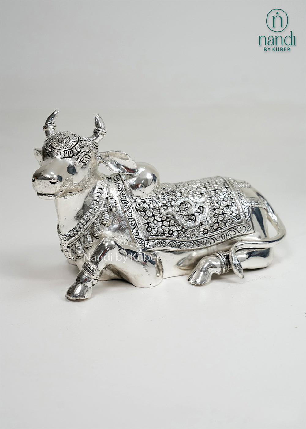Silver Nandi bull statue with Om carving and intricate detailing