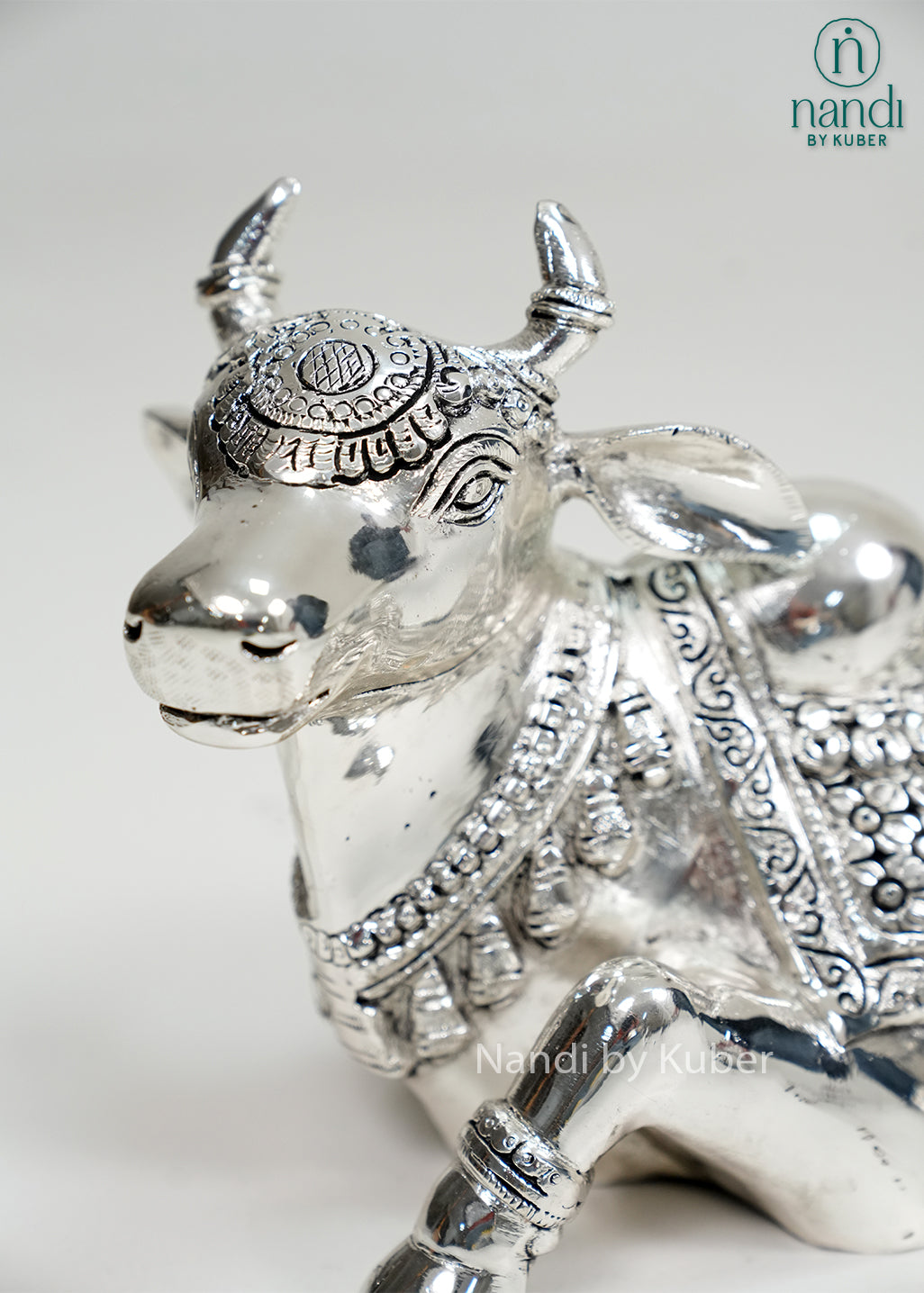 Silver Nandi bull statue with Om carving and intricate detailing