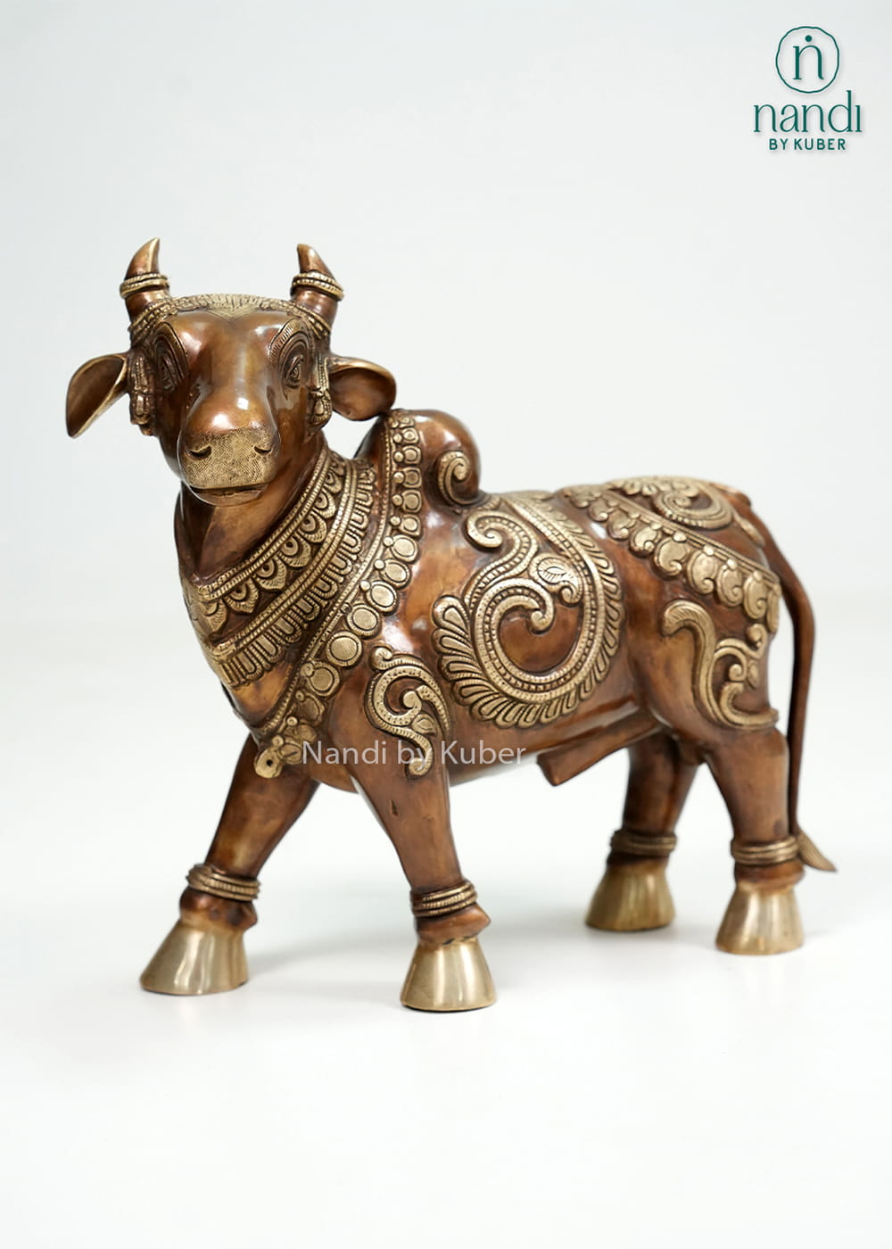 Two-tone brass Nandi bull statue with intricate carvings