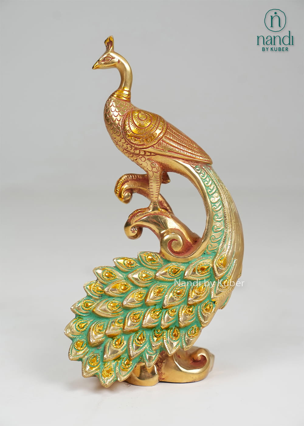 Brass peacock on decorative branch with enamel tail detailing
