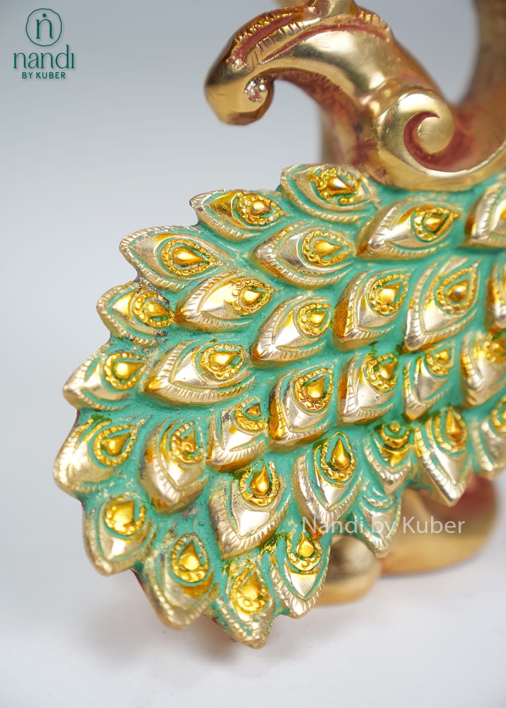 Brass peacock on decorative branch with enamel tail detailing