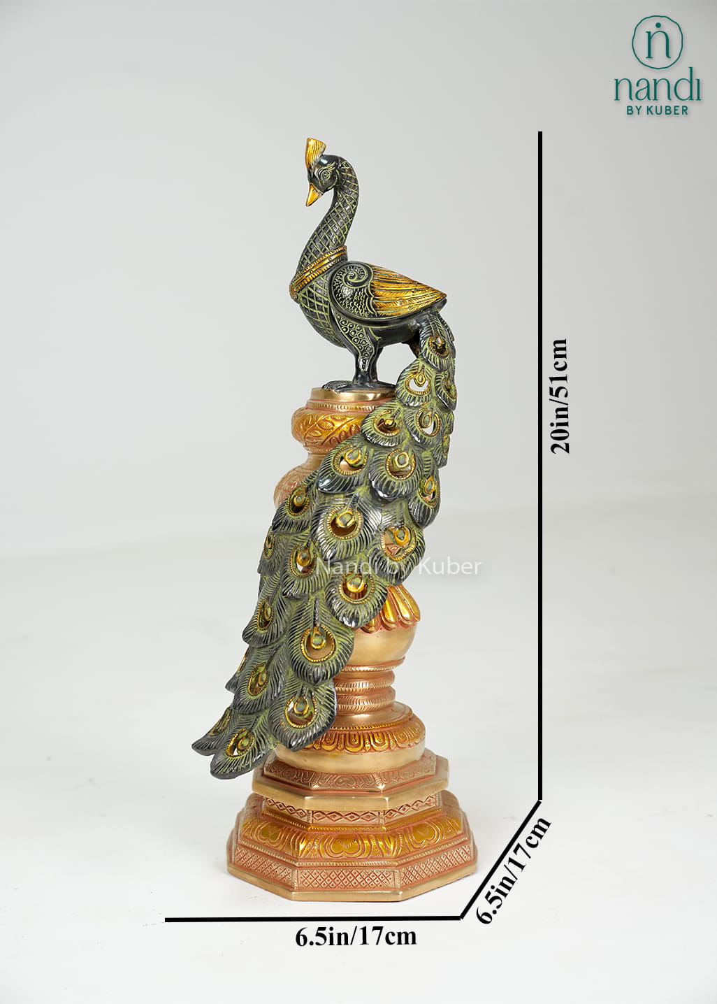 Brass peacock statue on decorative pedestal with detailed feather work