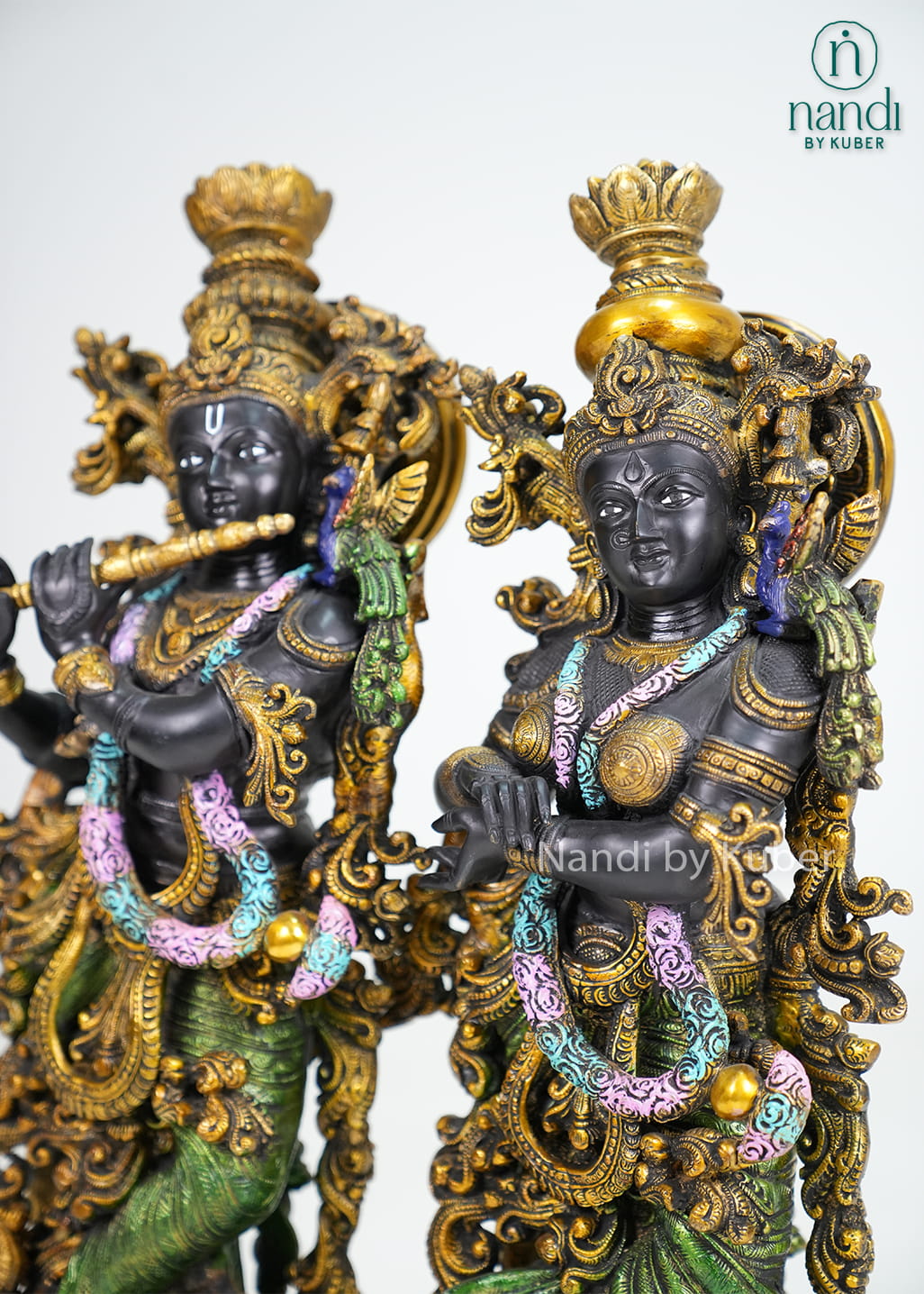 Brass Radha Krishna idol set with flute, ornate detailing, and multicolor accents
