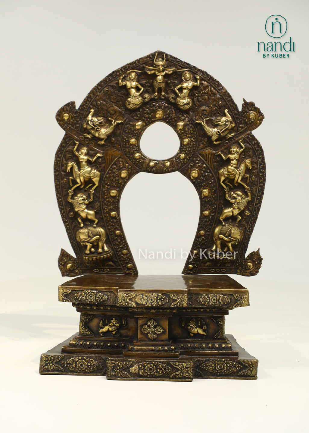 Intricately crafted brass sinhasan with an ornate arched design, perfect for displaying Buddha statues and enhancing sacred spaces with timeless elegance.