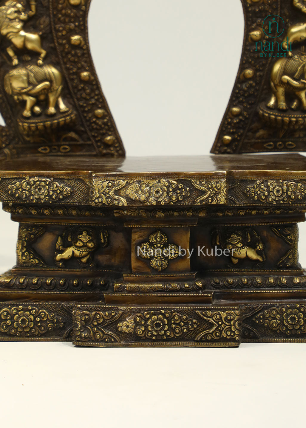 Intricately crafted brass sinhasan with an ornate arched design, perfect for displaying Buddha statues and enhancing sacred spaces with timeless elegance.