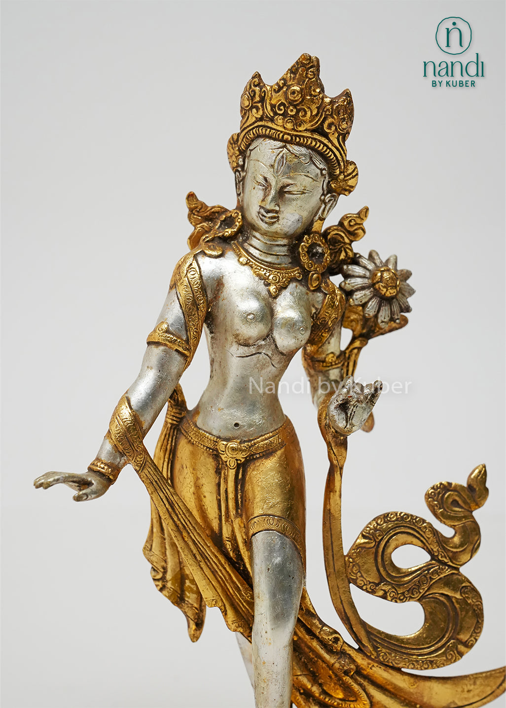 Elegant Tara standing statue in silver and gold finish, symbolizing compassion, wisdom, and serenity while enhancing any sacred or decorative space.