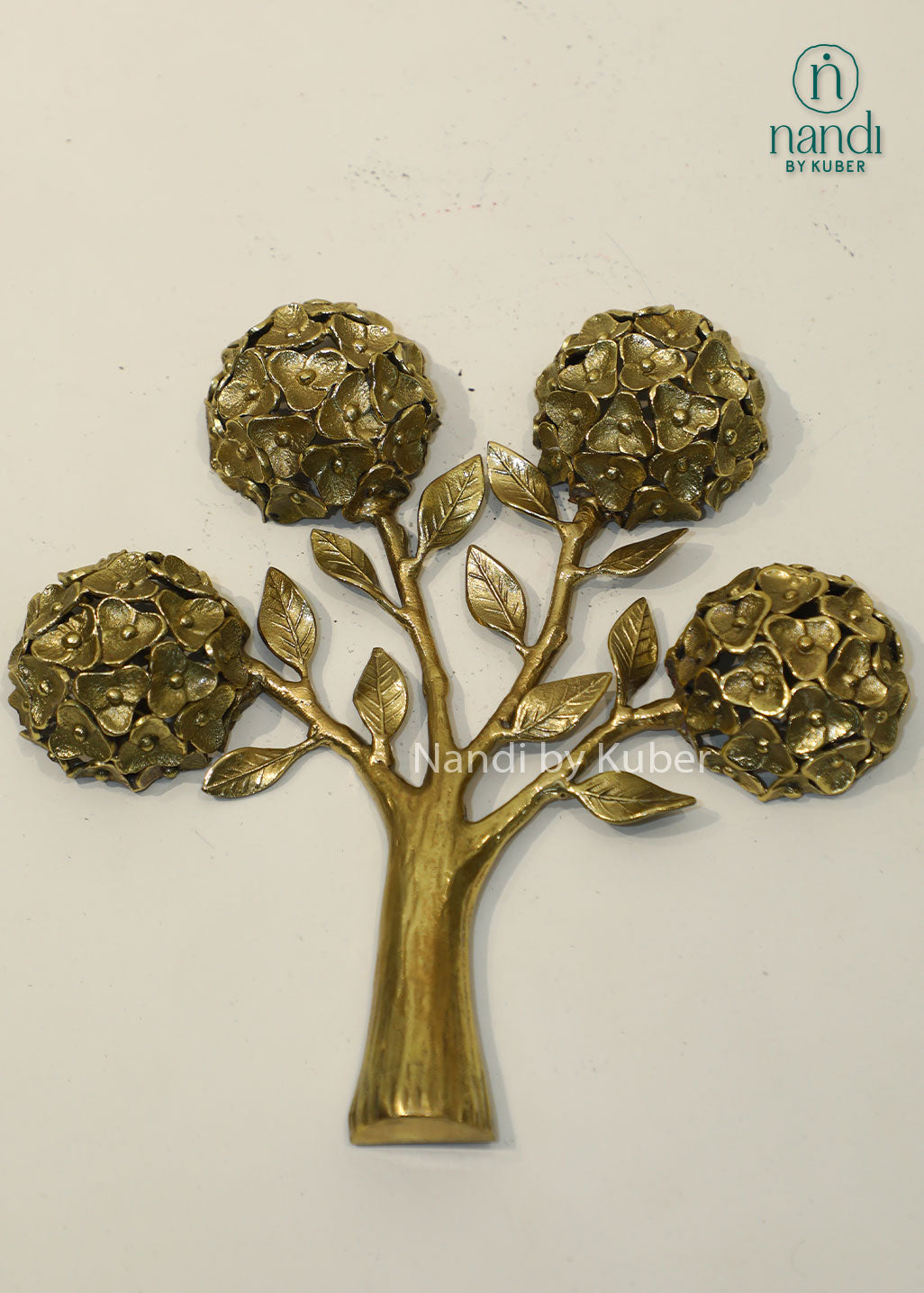 Handcrafted brass tree sculpture with floral motifs, antique gold finish decorative tabletop accent, metal tree of life décor for home, office, living room, and gifting.