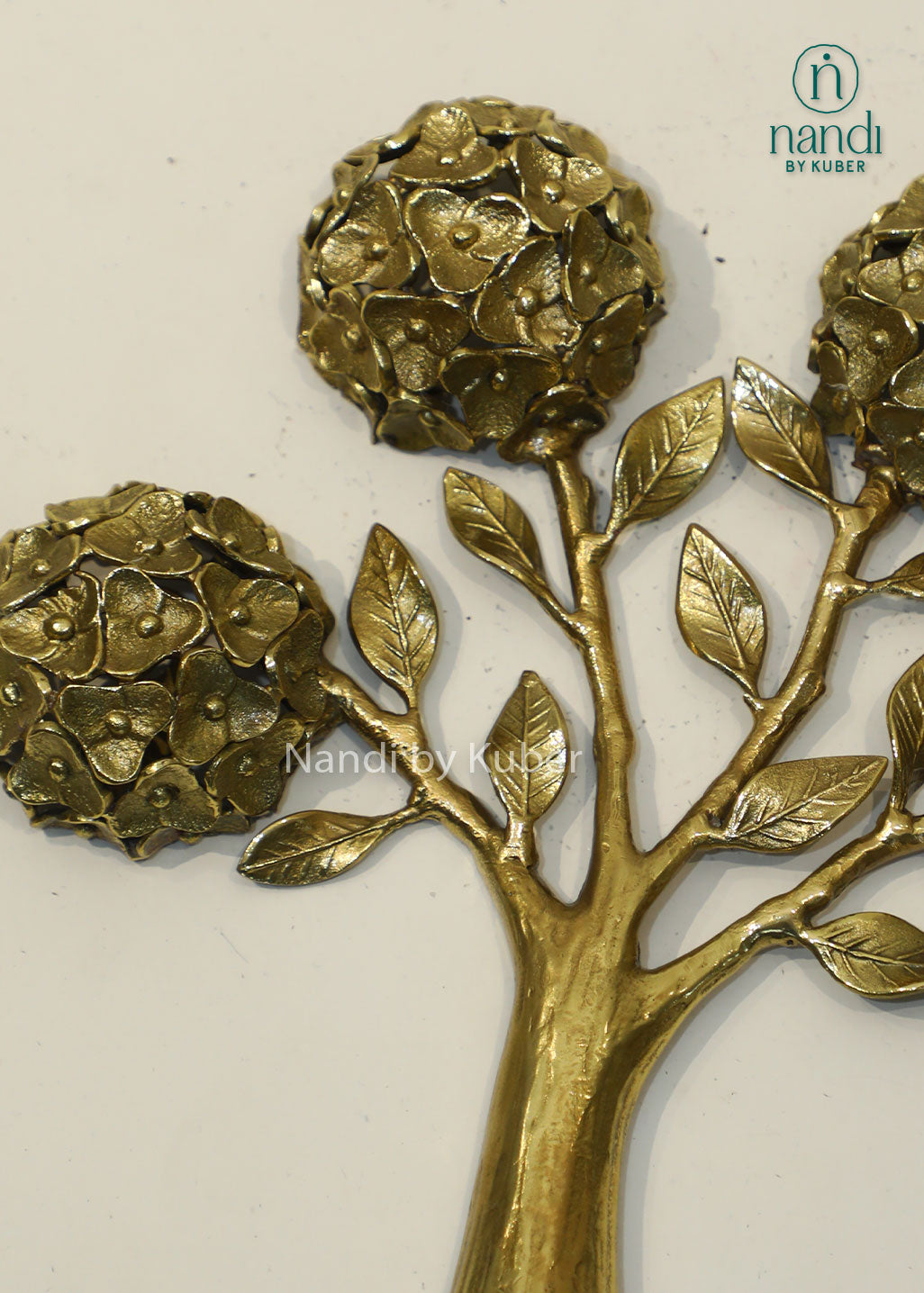 Handcrafted brass tree sculpture with floral motifs, antique gold finish decorative tabletop accent, metal tree of life décor for home, office, living room, and gifting.