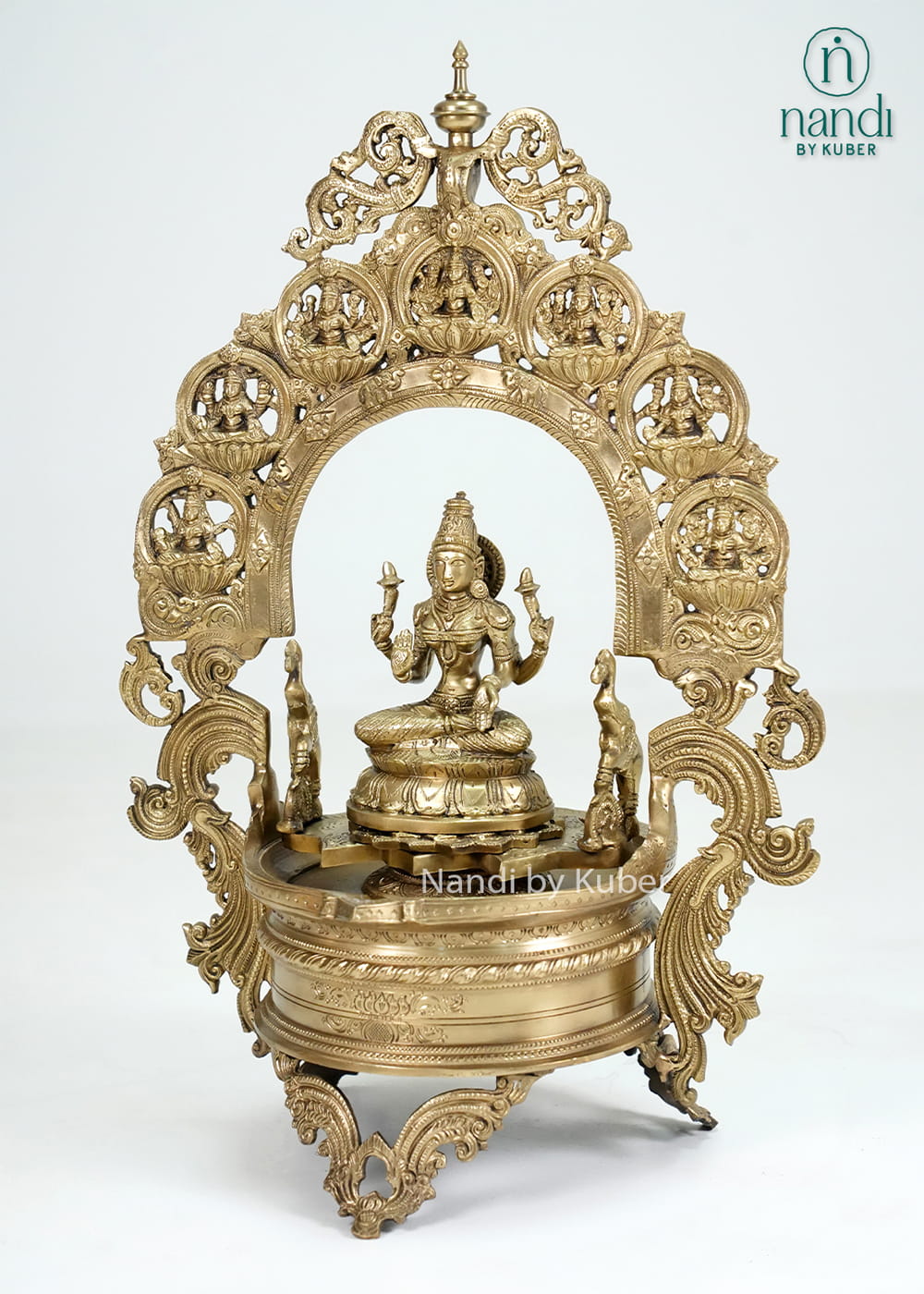 Bronze Ashtalakshmi urli with ornate arch, Lakshmi idol, and temple-style detailing
