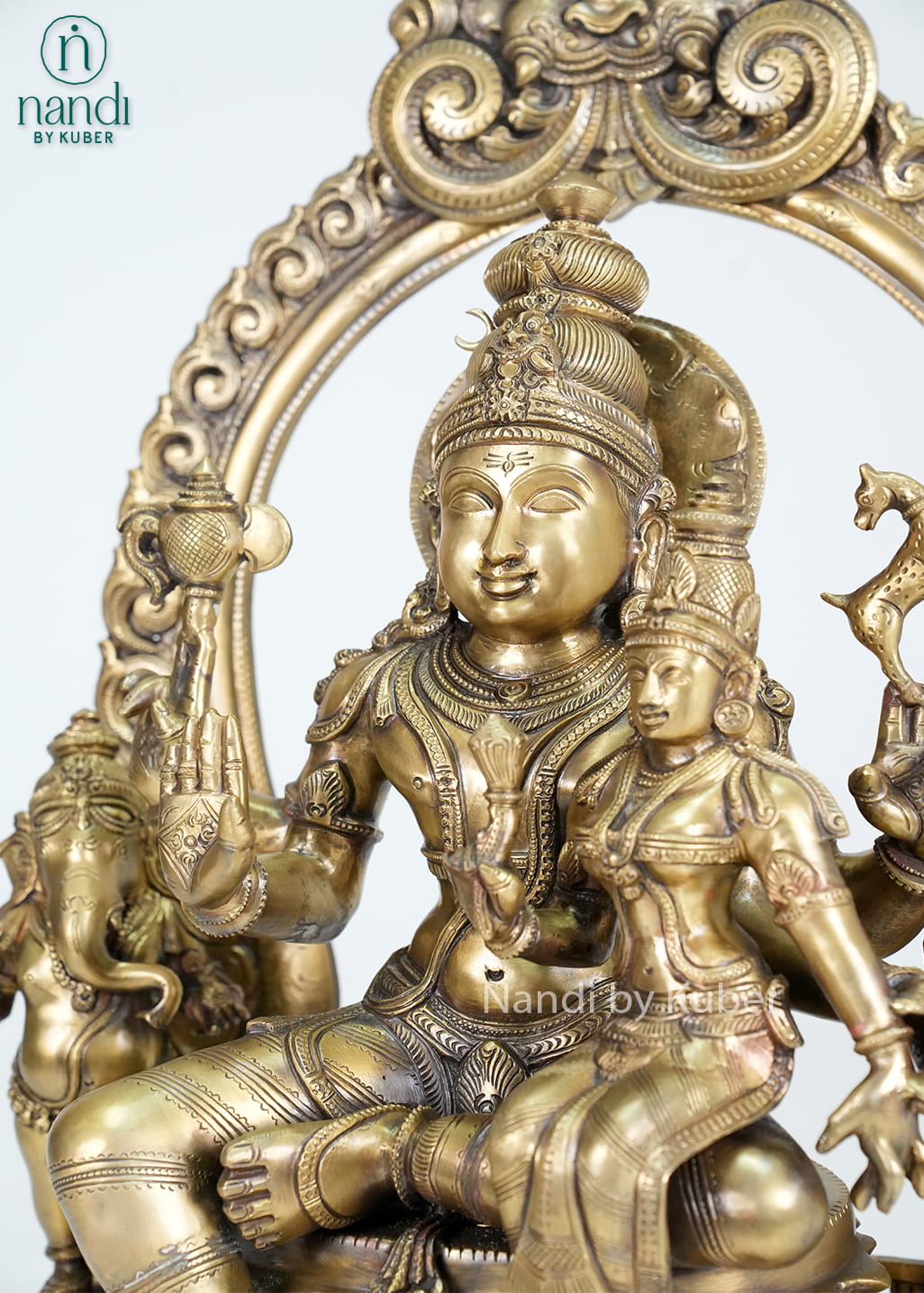 Bronze Shiva Parivar statue with ornate arch and traditional temple-style detailing