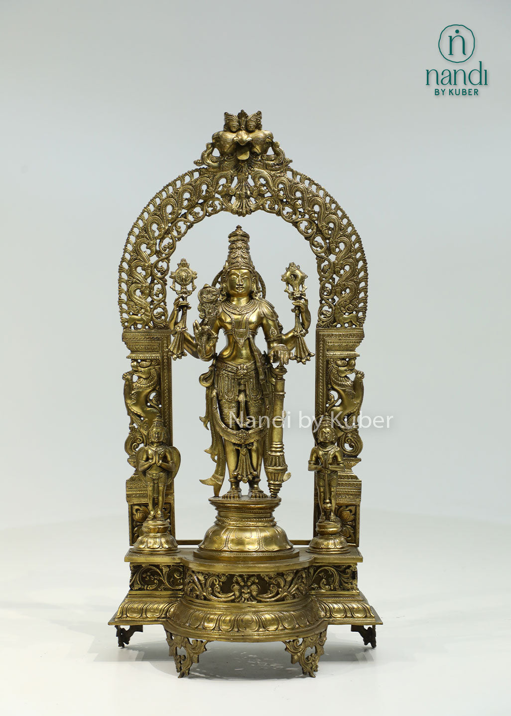 Intricately crafted bronze Lord Vishnu statue beneath an ornate arch, symbolizing divine protection, harmony, and timeless spiritual elegance.