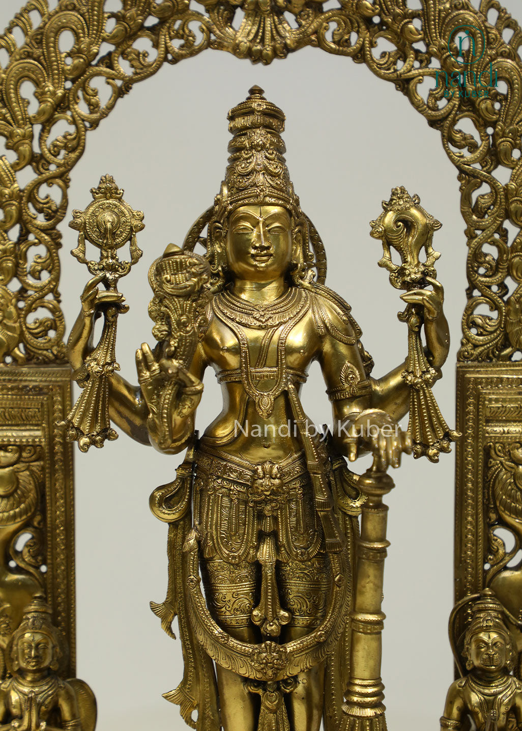 Intricately crafted bronze Lord Vishnu statue beneath an ornate arch, symbolizing divine protection, harmony, and timeless spiritual elegance.