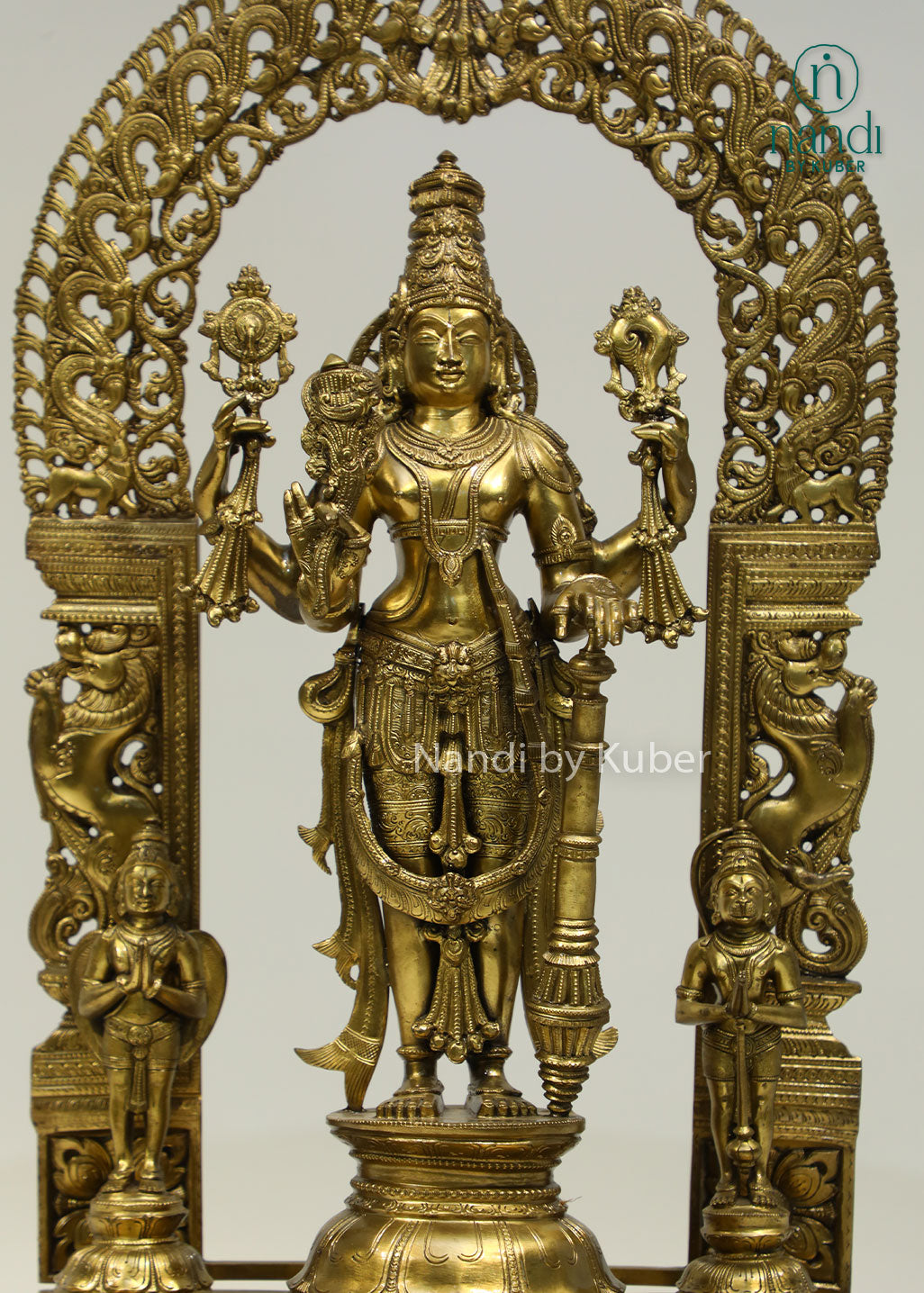 Intricately crafted bronze Lord Vishnu statue beneath an ornate arch, symbolizing divine protection, harmony, and timeless spiritual elegance.