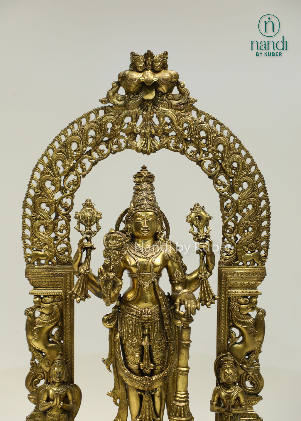 Intricately crafted bronze Lord Vishnu statue beneath an ornate arch, symbolizing divine protection, harmony, and timeless spiritual elegance.