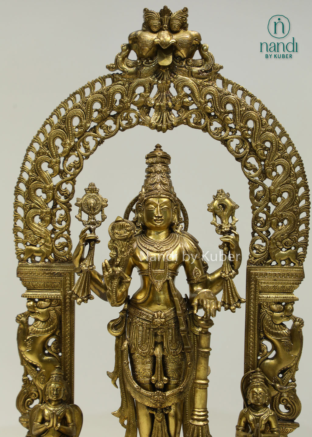 Intricately crafted bronze Lord Vishnu statue beneath an ornate arch, symbolizing divine protection, harmony, and timeless spiritual elegance.