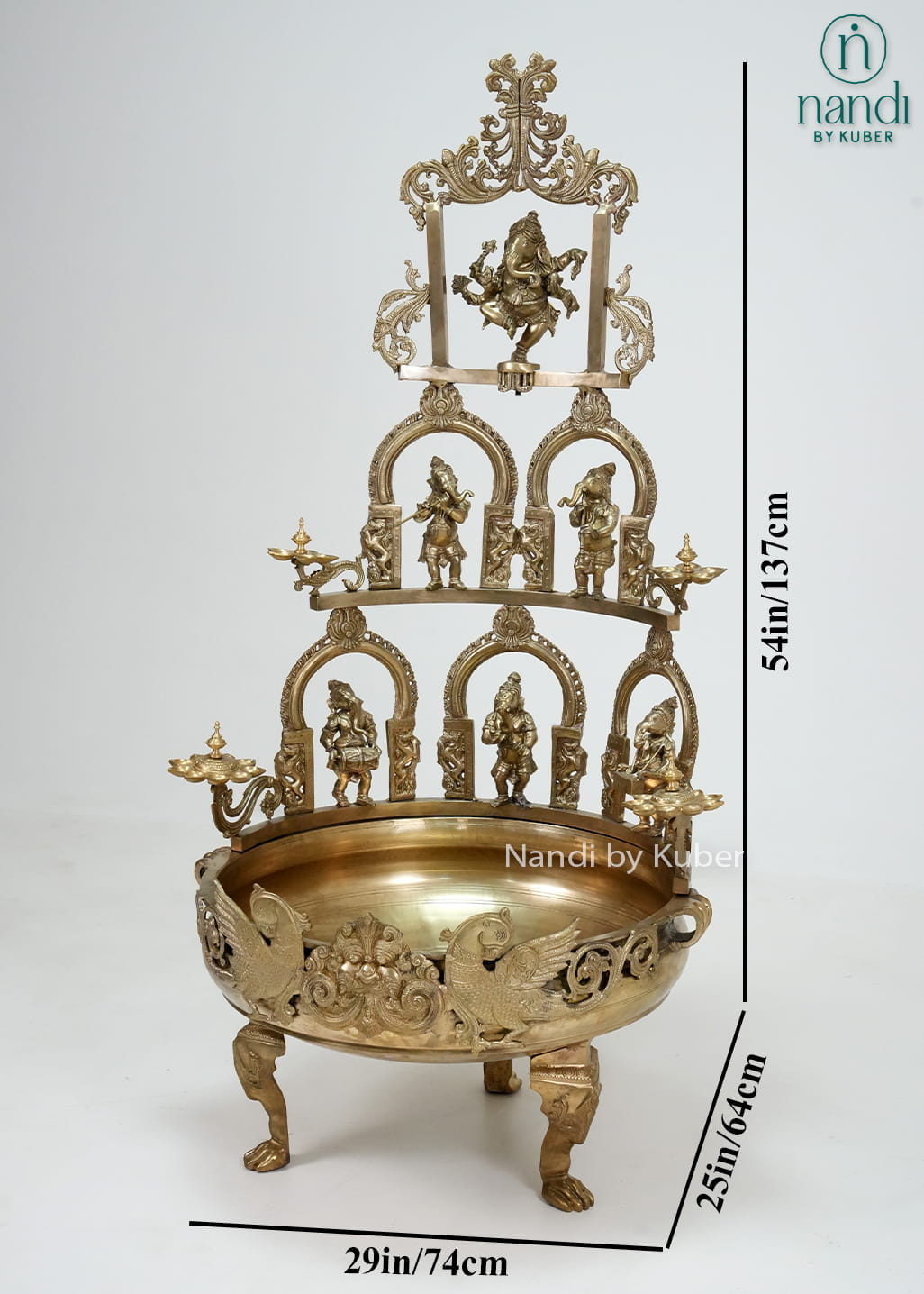 Decorative brass Ganesha urli with temple arch design, diya holders, and intricate detailing