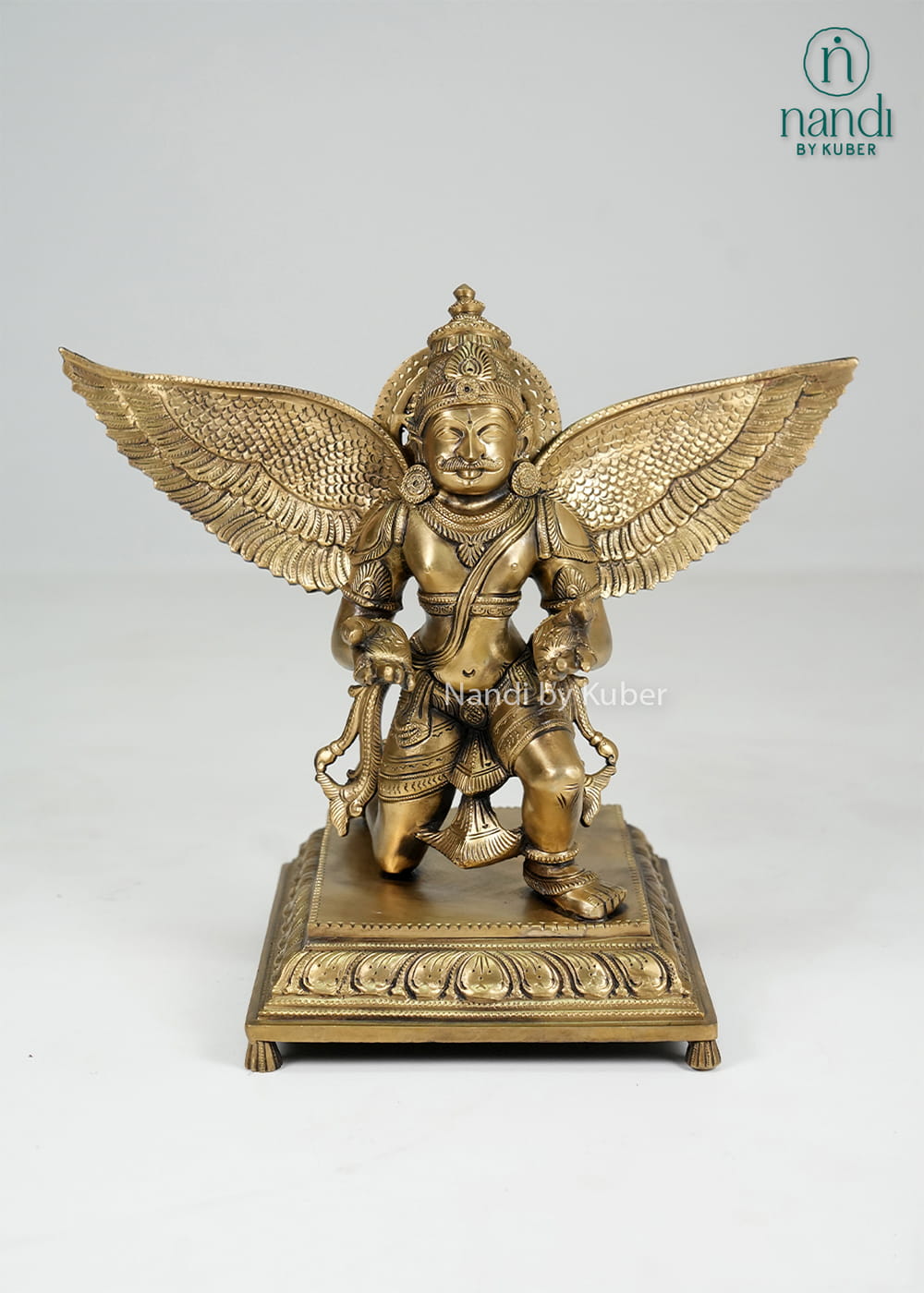 Bronze Garuda statue with spread wings on decorative base