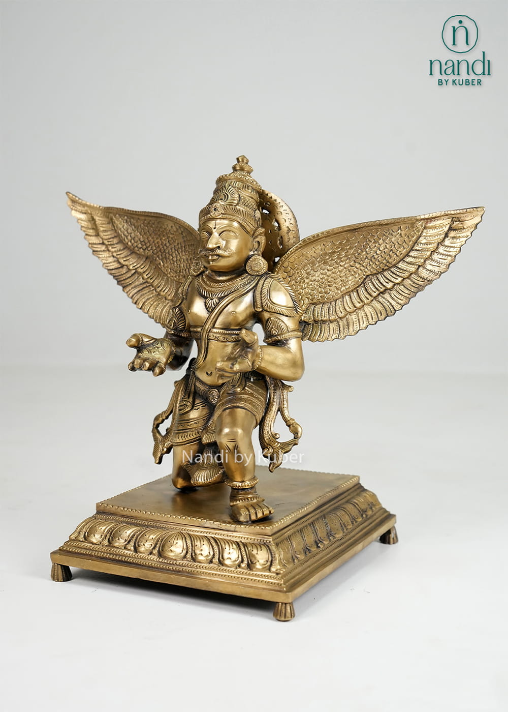 Bronze Garuda statue with spread wings on decorative base