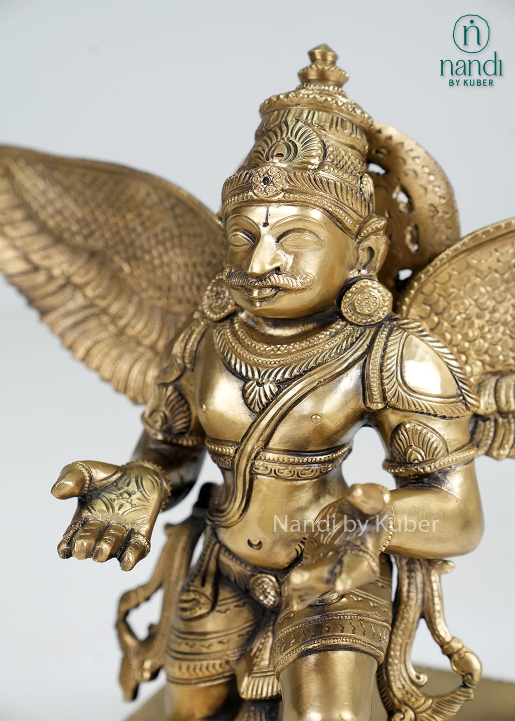 Bronze Garuda statue with spread wings on decorative base