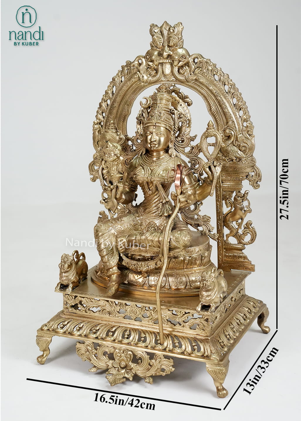 Bronze Rajarajeshwari Devi statue with ornate arch and temple-style detailing