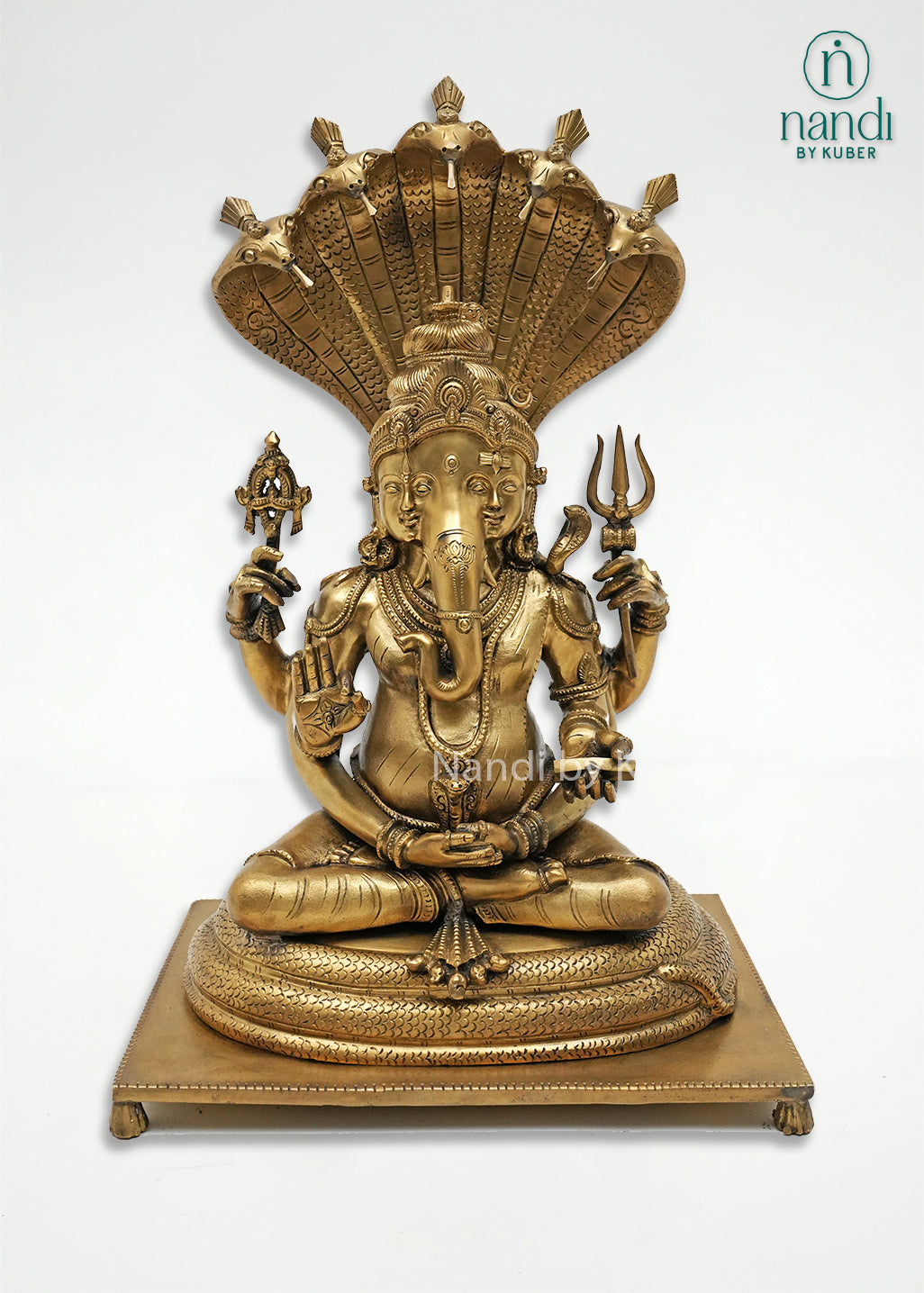 Handcrafted bronze Trimurti Ganesha idol with serpent hood canopy, intricate Hindu symbolism, and detailed pedestal base, ideal for home temples, spiritual décor, devotional worship, and religious gifting.