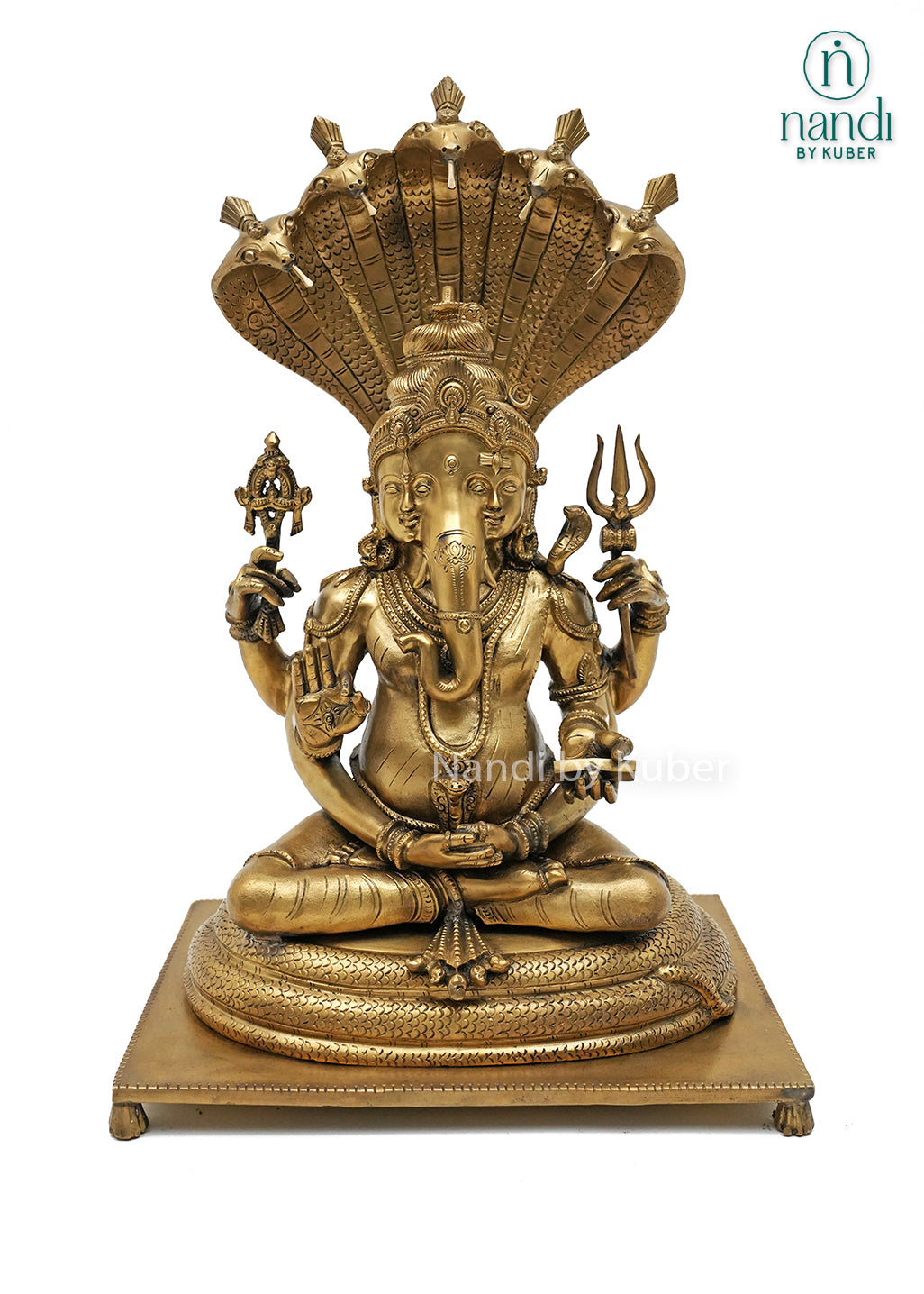 Handcrafted bronze Trimurti Ganesha idol with serpent hood canopy, intricate Hindu symbolism, and detailed pedestal base, ideal for home temples, spiritual décor, devotional worship, and religious gifting.