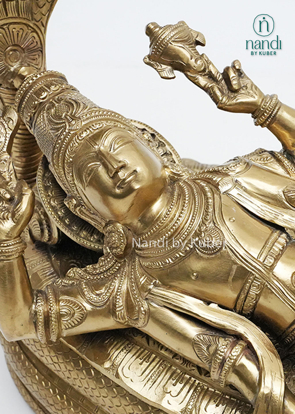 Handcrafted bronze Anantha Shayana Vishnu sculpture depicting Lord Vishnu reclining on Sheshnag with ornate carvings and sacred symbolism, ideal for temple décor, pooja spaces, and spiritual home interiors.