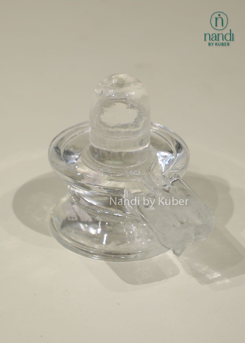 Natural Clear Crystal Shivling statue, transparent crystal Shiva Lingam for home temple, puja room, meditation, Vastu, spiritual healing, positive energy, devotional worship, and sacred Hindu décor.