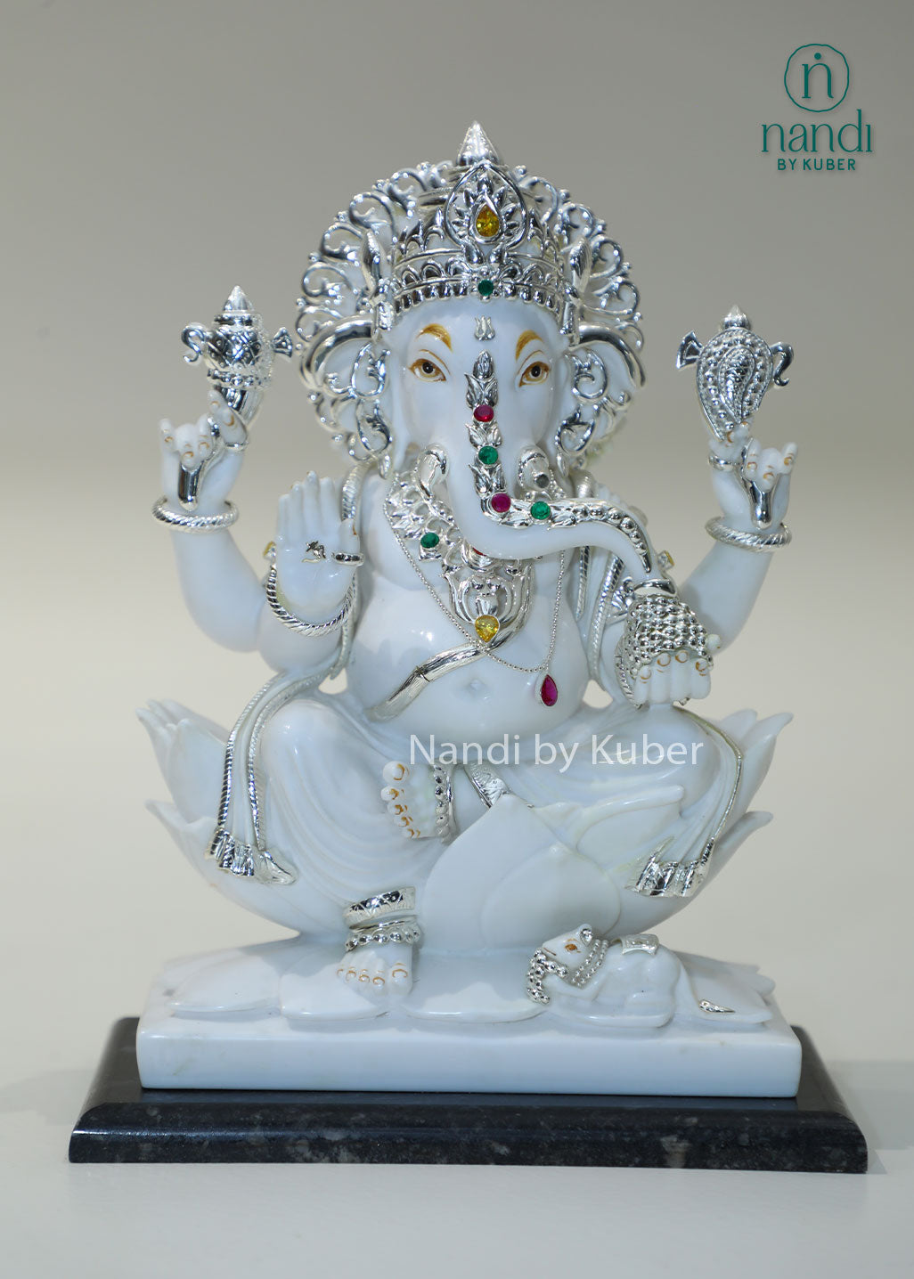 Handcrafted white marble Ganesha statue with  lotus base, ideal for pooja rooms, spiritual décor, temple spaces, festive gifting, and luxury home decoration.