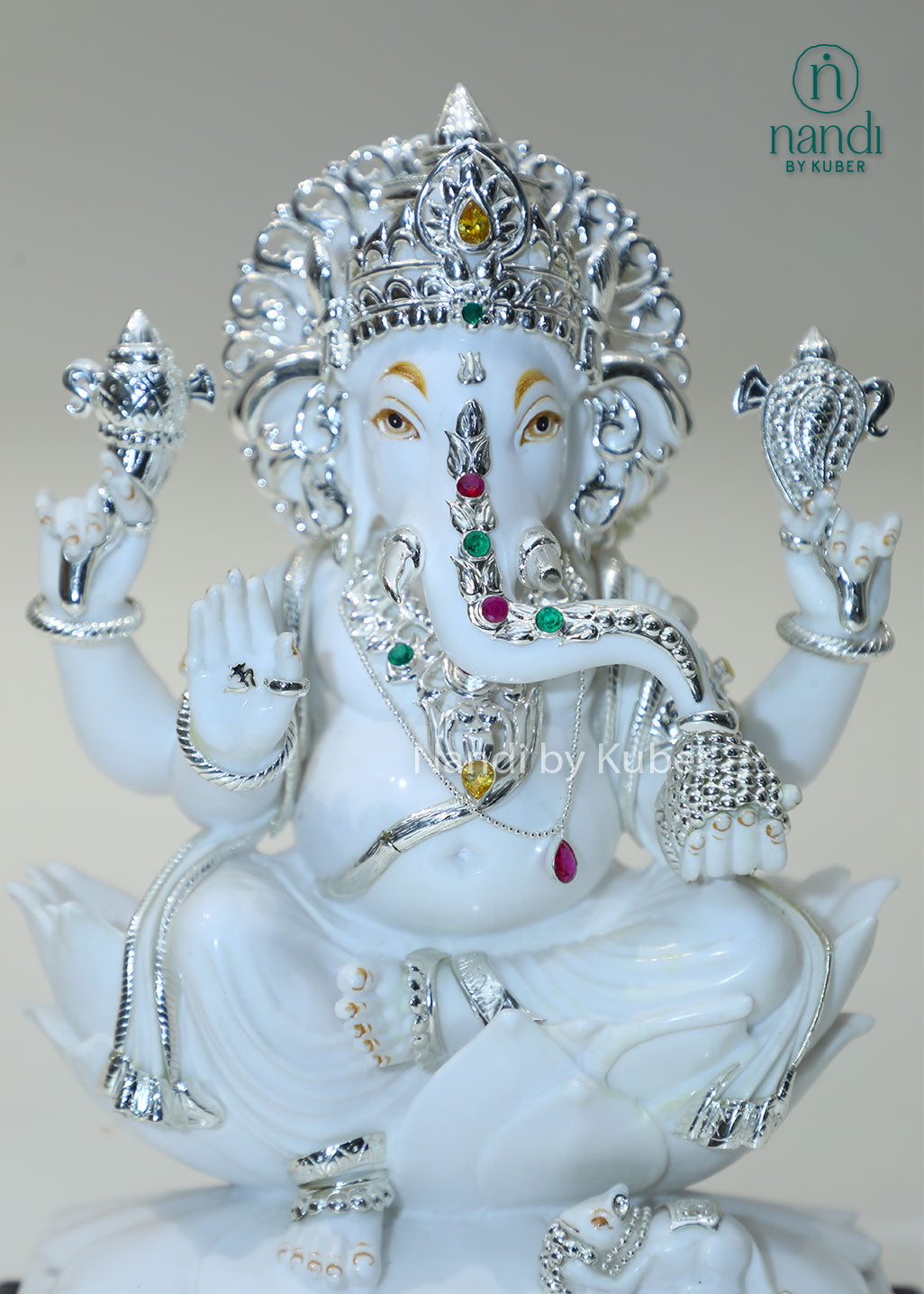Handcrafted white marble Ganesha statue with  lotus base, ideal for pooja rooms, spiritual décor, temple spaces, festive gifting, and luxury home decoration.