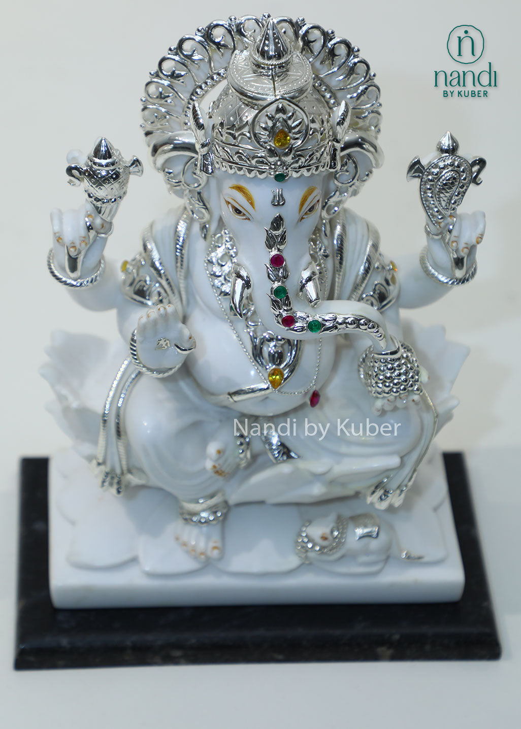 Handcrafted white marble Ganesha statue with  lotus base, ideal for pooja rooms, spiritual décor, temple spaces, festive gifting, and luxury home decoration.