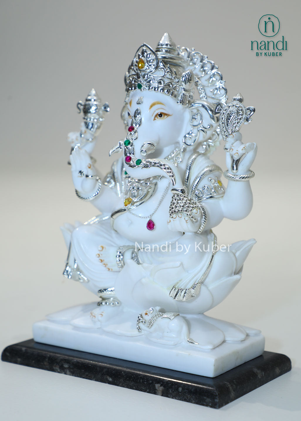 Handcrafted white marble Ganesha statue with  lotus base, ideal for pooja rooms, spiritual décor, temple spaces, festive gifting, and luxury home decoration.