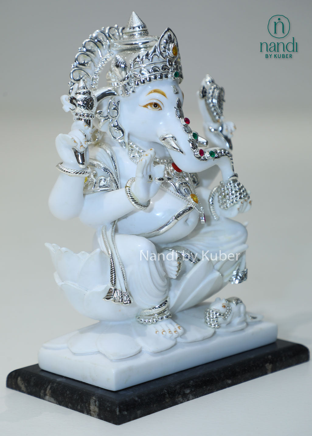 Handcrafted white marble Ganesha statue with  lotus base, ideal for pooja rooms, spiritual décor, temple spaces, festive gifting, and luxury home decoration.