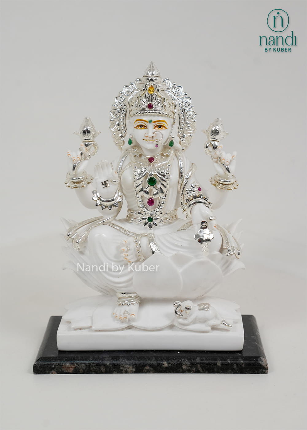 White marble Lakshmi statue seated on a lotus