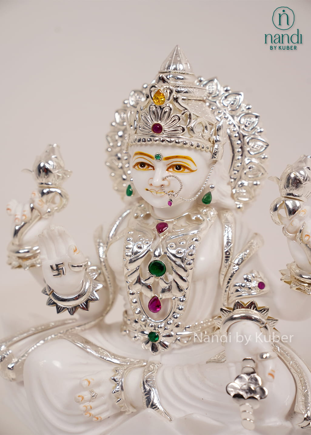 White marble Lakshmi statue seated on a lotus