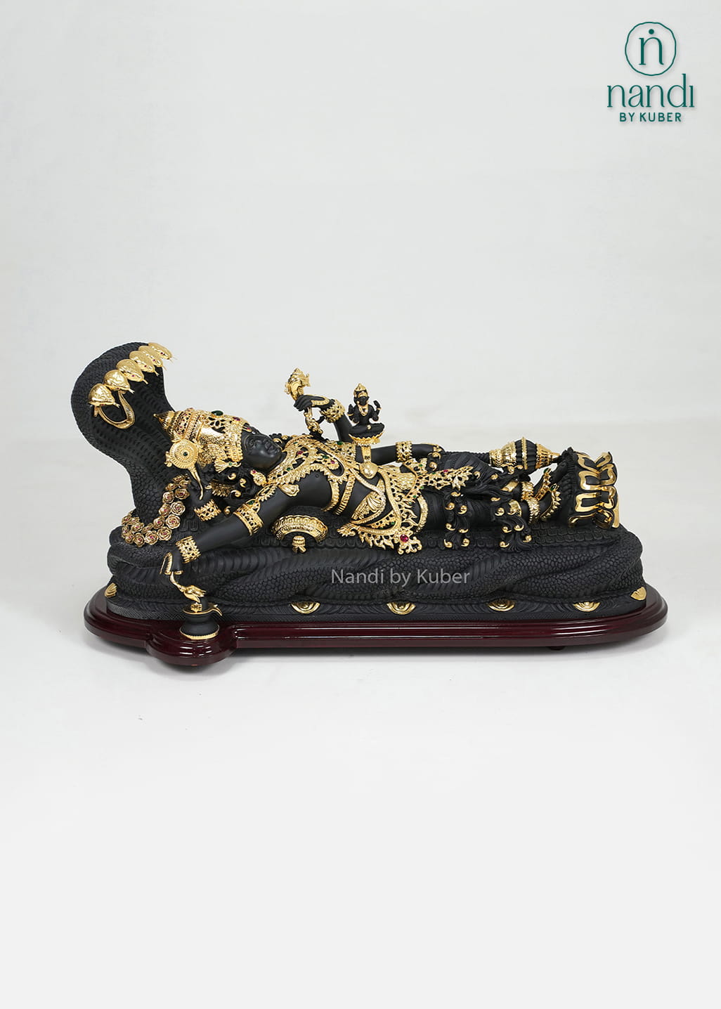 Black marble Padmanabha Swamy idol with gold detailing and decorative display base