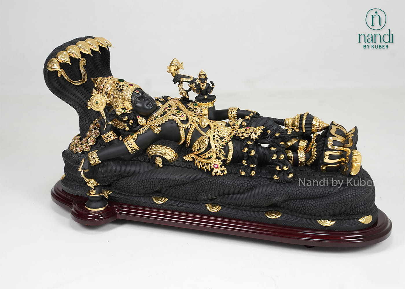 Black marble Padmanabha Swamy idol with gold detailing and decorative display base