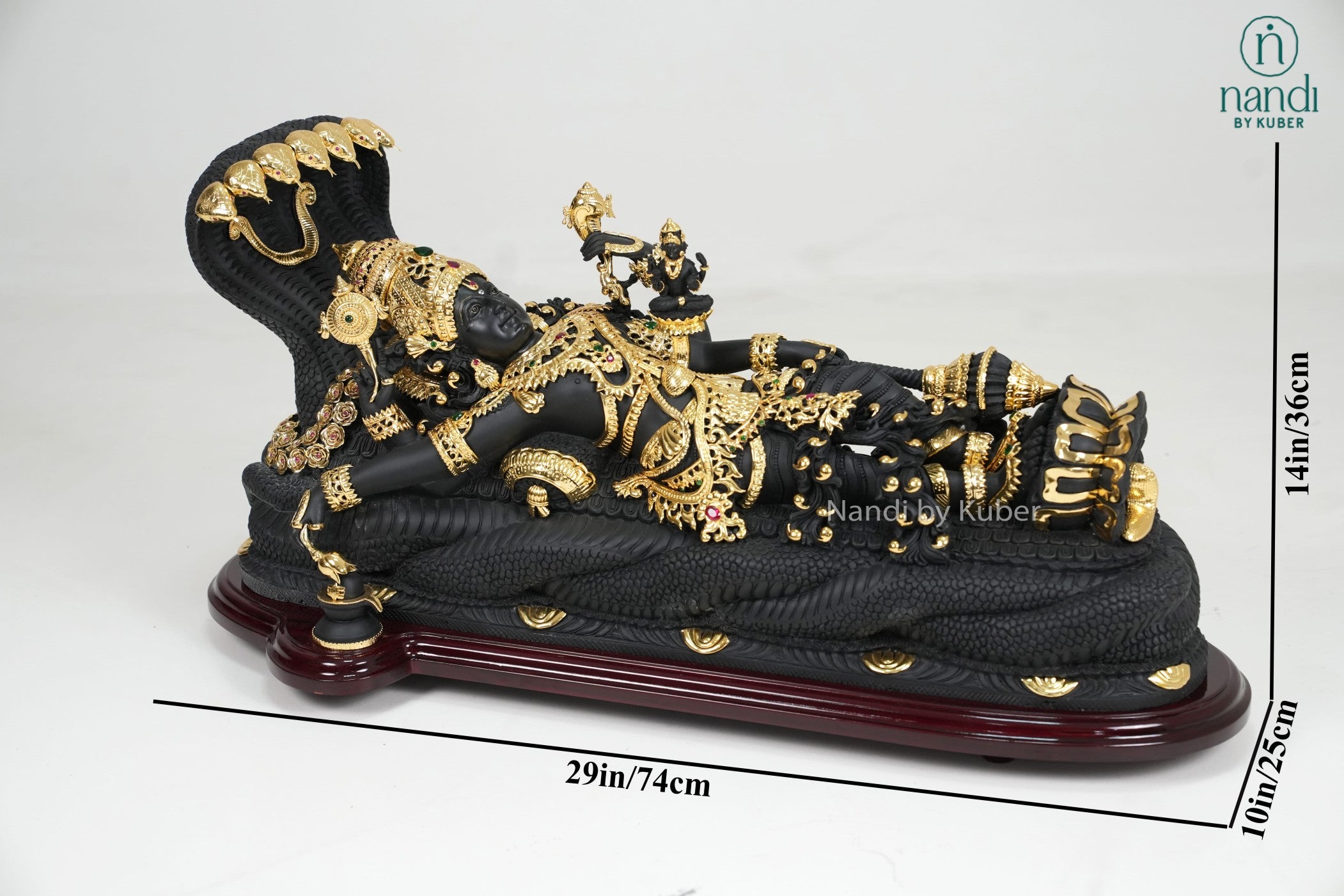 Black marble Padmanabha Swamy idol with gold detailing and decorative display base