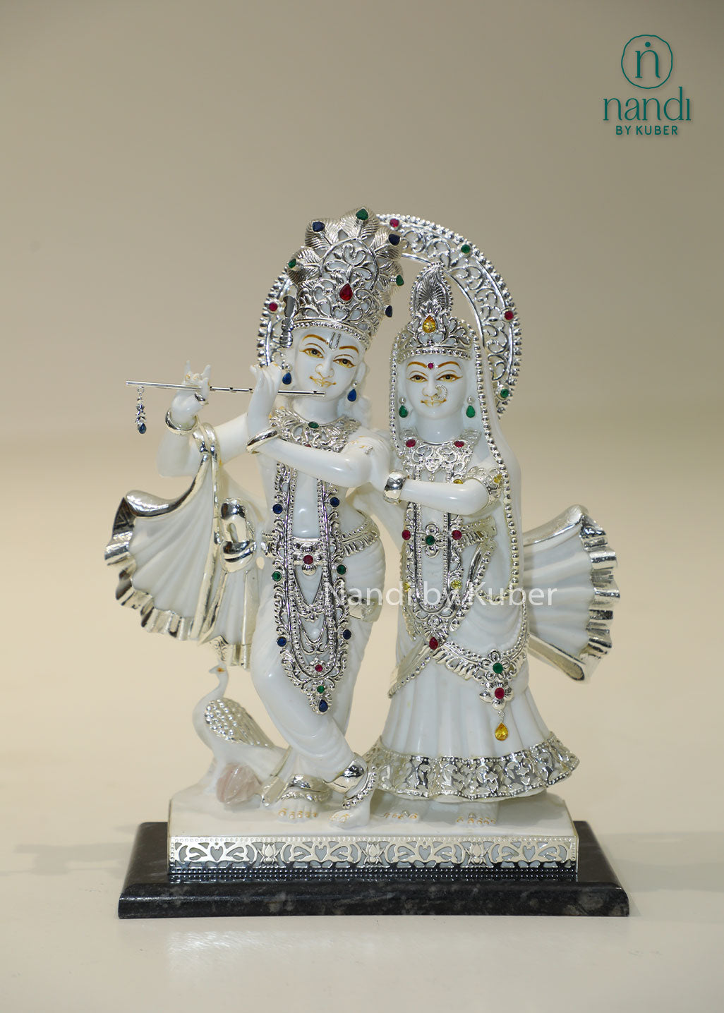 Marble Radha Krishna idol with silver embellishments and gemstone accents, divine Jugal Jodi statue for home temple, pooja room décor, spiritual worship, Vastu, meditation, festive gifting, love, harmony, and devotion.