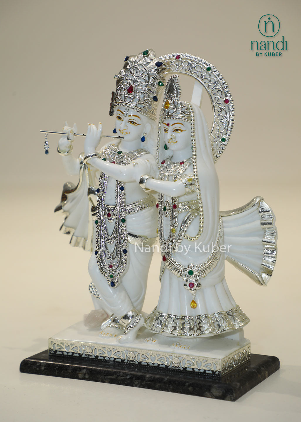 Marble Radha Krishna idol with silver embellishments and gemstone accents, divine Jugal Jodi statue for home temple, pooja room décor, spiritual worship, Vastu, meditation, festive gifting, love, harmony, and devotion.
