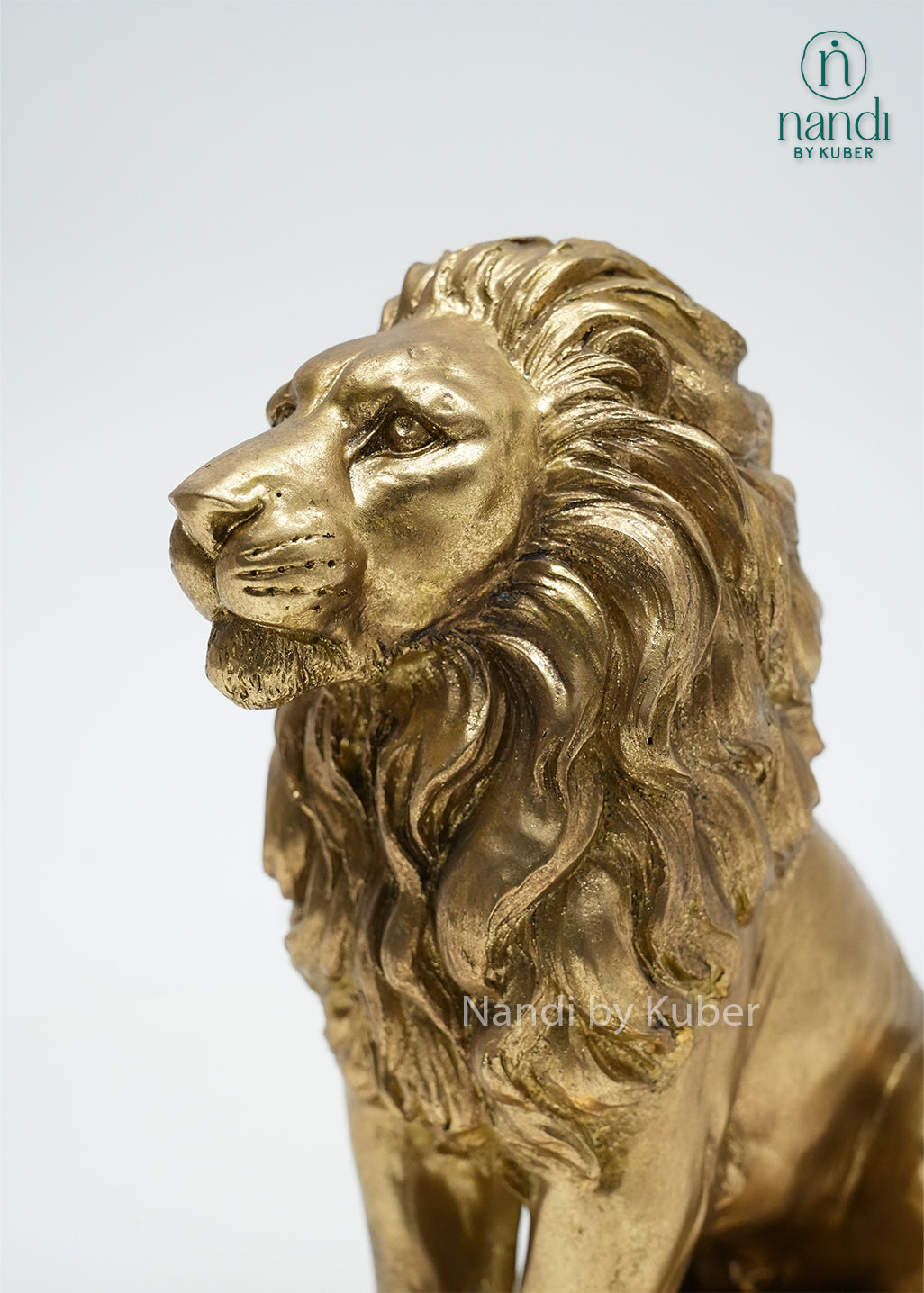 Decorative golden lion figurine with intricate detailing, symbolizing strength, leadership, courage, and regal elegance.